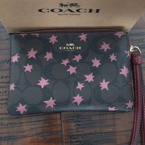 NWT Coach Wristlet Dark Brown with Mauve Stars
